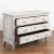 Large chest of three drawers with carved panels from France, circa 1820-40. The newer, professionally applied soft gray...