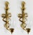 Vintage pair of large classic solid brass French Empire style sconces, each with a ribbon tied torch. The sconces have one...