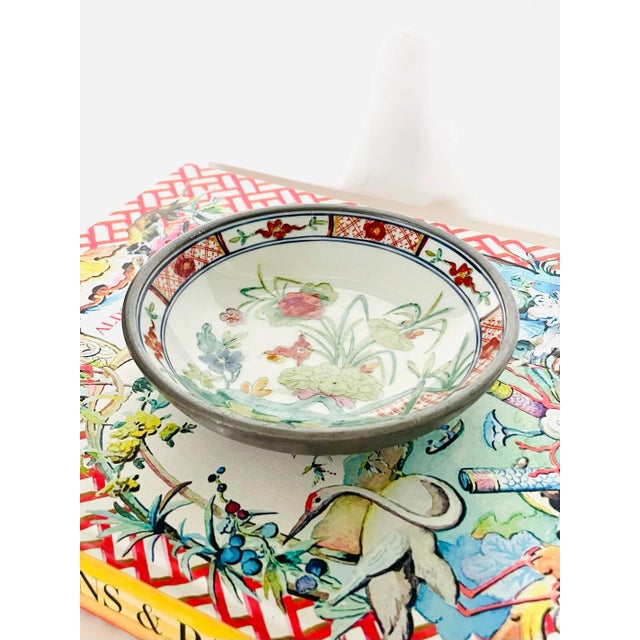 Encased in pewter, this Japanese porcelain bowl was hand-decorated in Hong Kong, circa 1970s/80s. Very good vintage...