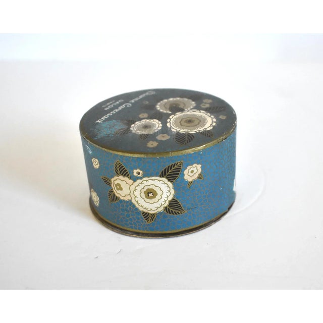 An antique, 1920s, Art Deco round powder box, unopened, in the "Charme Caressant" perfume by Dalon, Paris, first made in...