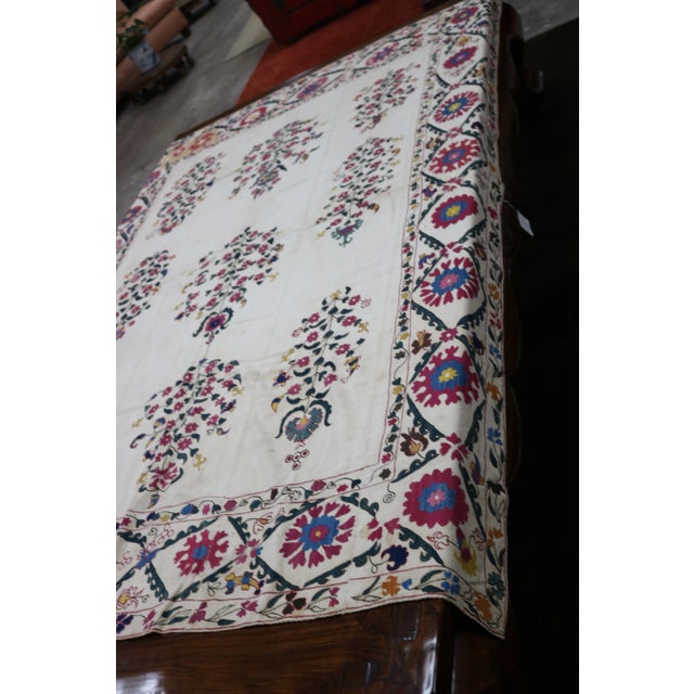 Uzbekistan susani textile , Early 19th c. cotan backing with silk embroidery. wear with age. hand made.