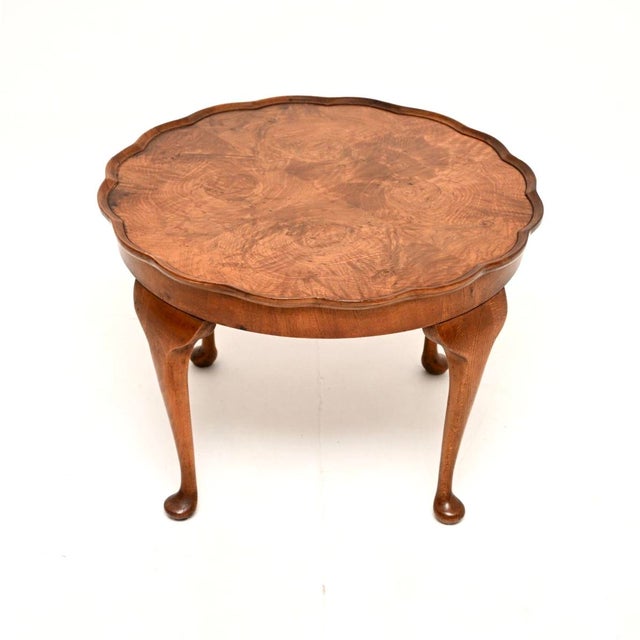 A beautiful antique burr walnut pie crust coffee table. This was made in England, it dates from the 1920’s. The quality is...