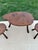 C. 1950s-60s mid-century rustic elm 3-piece table and stools set on tripodal legs. Table: 18.75"h x 32.5"w x 21"d Stools:...
