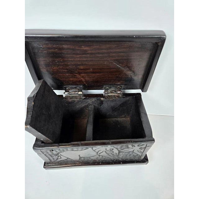 Vintage hand-carved dark wood elephant trinket jewelry box featuring a beautifully detailed safari-inspired design and...