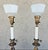 Here is a pair of regal, tall, antiqued brass lamps with ceramic base and textured glass shades. The upper portion of the...