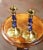 Add timeless elegance to your space with this colorful pair of antique patinated brass candlestick holders. Crafted in...