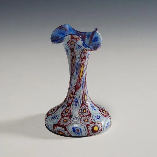 A nice Millefiori Murano glass vase with undulating rim. Manufactured by Vetreria Fratelli Toso, Murano around 1910....