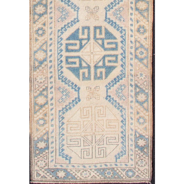 Measures: 2'4 x 9'8 Vintage Turkish Oushak Runner in Soft Blue and Warm Beige Tones. Keivan Woven Arts / Rug /EN-176359,...