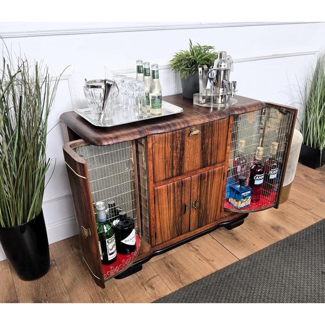 Beautiful Italian Art Deco Mid-Century Modern dry bar cabinet decorated in veneer briar burl wood, with two side doors,...