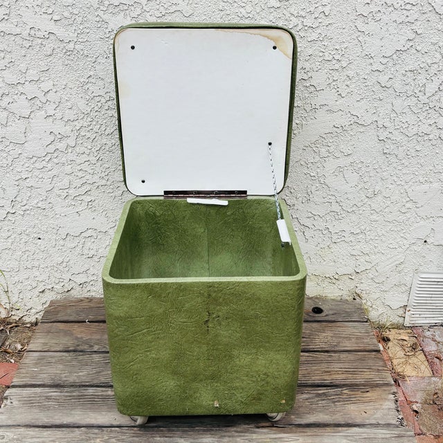 Add authentic Mid-Century Modern style to your home with this vintage green vinyl storage ottoman/hassock by Ryan &...