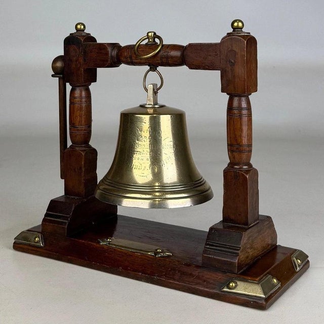 A charming and highly decorative early 20th-century English Edwardian brass bell, beautifully presented within a finely...