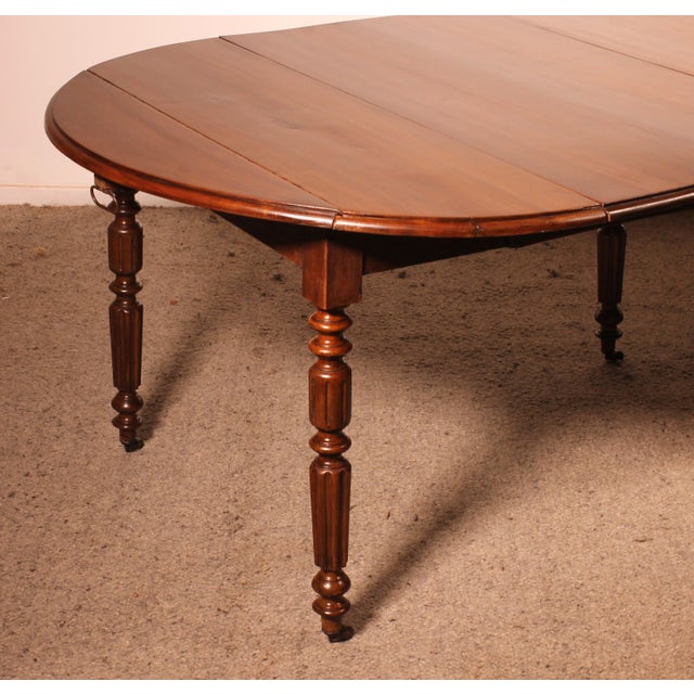 Superb early 19th-century solid walnut dining table with six legs, measuring 2.27 meters in length. The table and its...