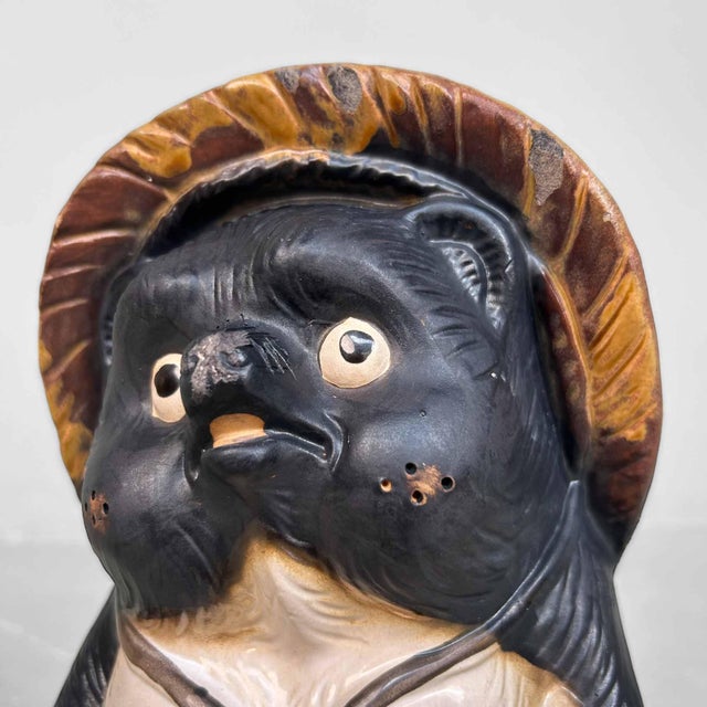 Cheerful Tanuki Statue made of Shigaraki Pottery, 1980s, Shōwa Period, Japan. This Tanuki statue, crafted from Shigaraki...