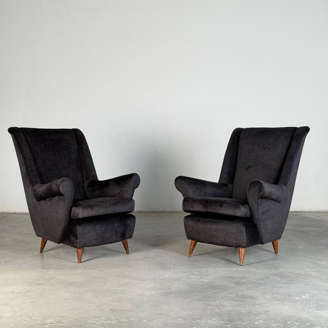 A striking and exceptionally comfortable pair of Italian armchairs produced by ISA Bergamo in the 1950s, attributed to Gio...