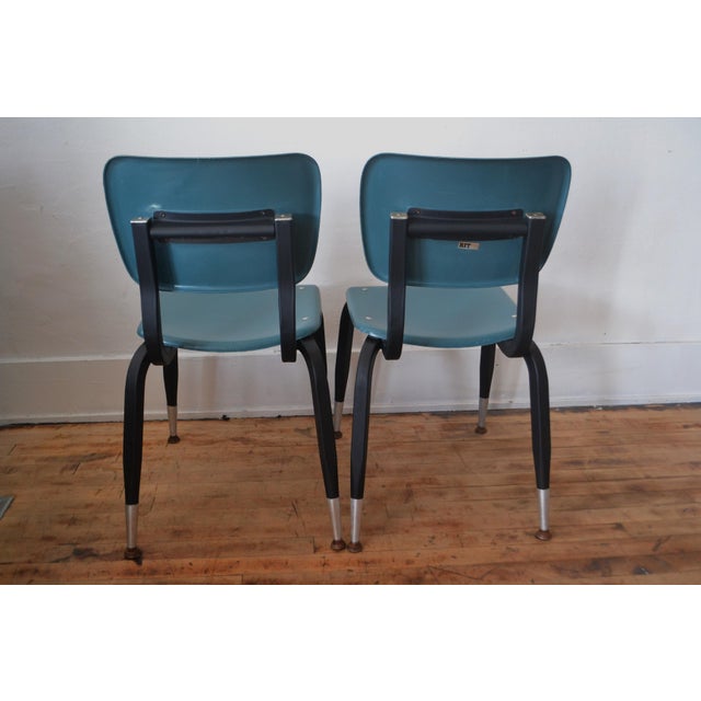 Vintage American Desk Manufacturing Co. Student Chairs. c. 1970s. Blue fiberglass seat and chair back, steel rivets with...