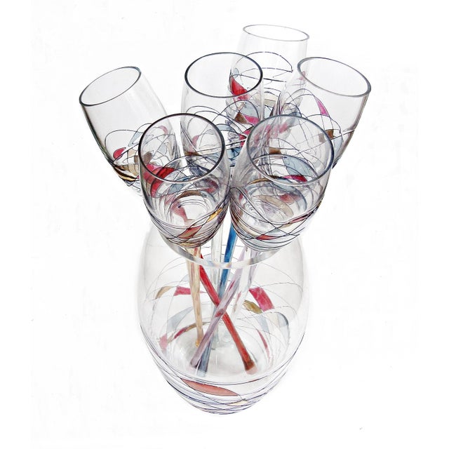 A wonderfully sculptural 7-piece art glass set with six exceptionally long champagne flutes and a matching vase, all...