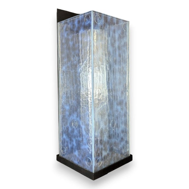 Deep black oxide McEwen Lighting Nebula Wall sconces with seeded opal kiln-formed glass. Constructed from copper, Lucite...