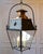 A striking 20th-century French hanging lantern crafted in copper and iron, combining traditional craftsmanship with a...