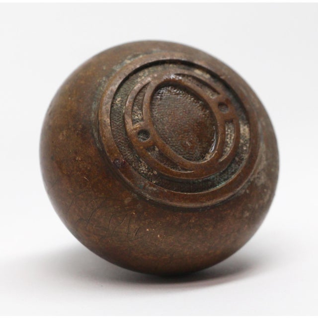 This emblematic O design bronze doorknob is part of the P-72900 O group. The manufacturer and date of creation is unknown....