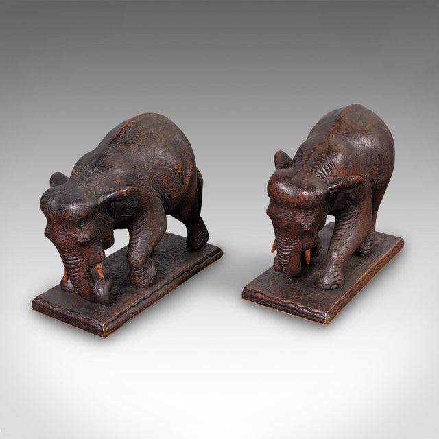 This is a pair of antique elephant bookends. An English, mahogany ornamental wildlife study, dating to the late Victorian...