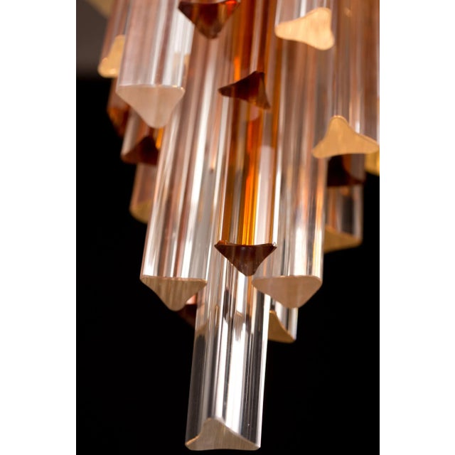 This very stylish late 20th-century chandelier is made from Murano glass with a brass frame. It was designed by Marcel...