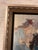 This stunning framed painting features a contemporary abstract portrait, signed by the artist which appears to be “F...