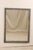A vintage French painted wood mirror. This French mirror from the mid 20th century is rectangular-shaped with simple and...