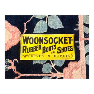 Antique Woonsocket Rubber Boots & Shoes Embossed Tin Sign For Sale