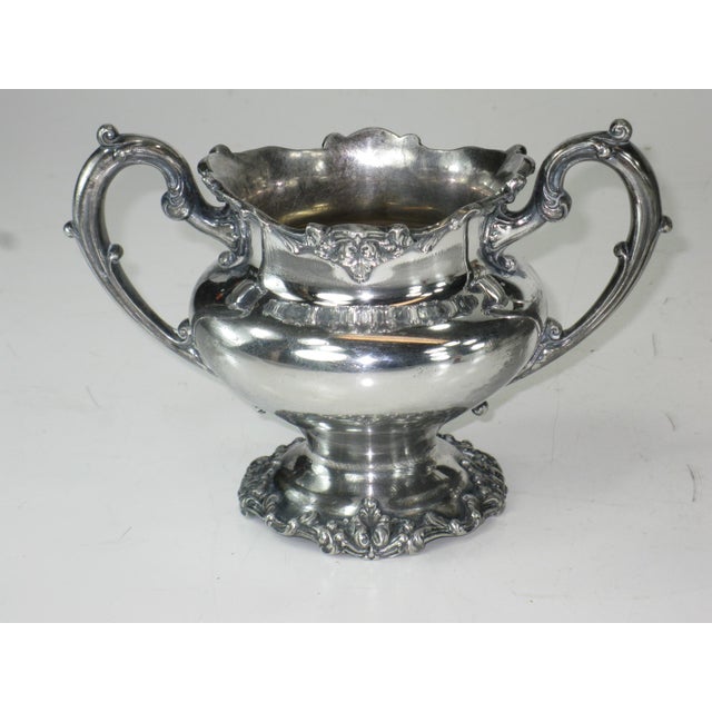 This antique tea or coffee set would be a stunning addition to any collection. Crafted by REED & BARTON, this 3-piece set...