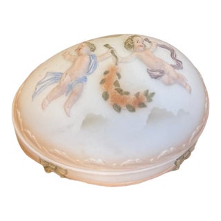 Vintage Andrea by Sadek Bisque Porcelain Oval Egg Trinket Box With Cherub Relief and Floral Garland Motif For Sale