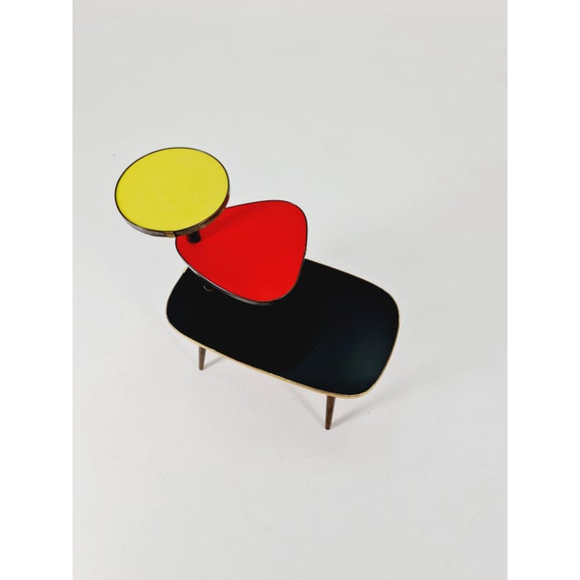 Small German plant stand, colorful vintage mid-century minimalist indoor flower table, 1960s. Its extraordinary design is...