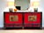 Chinese sideboard lacquered in black and red with painted panels featuring floral decorations Period: 1930s Made of fir...