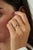 This band ring features a 0.15 carat baguette-cut blue sapphire, set in 14K white gold. The sapphire measuring...