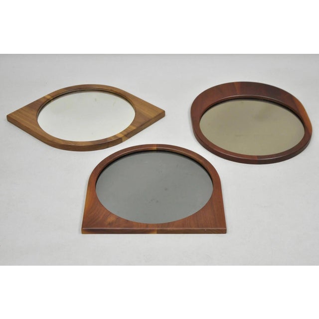 Mid Century Danish Modern Style Sculpted Teak Wood Mirrors - 3 pc Set. Listing includes all three mirrors. (1) cat eye...