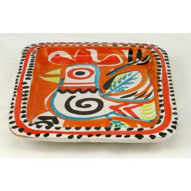 Vivid Italian pottery hand painted tray, depicting an abstract stylized rooster. The tray was made in Italy for the...