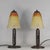 Darboy A pair of 1925-30 French art deco lamps. Daum made coloured shades on wrought iron bases of outstanding quality...