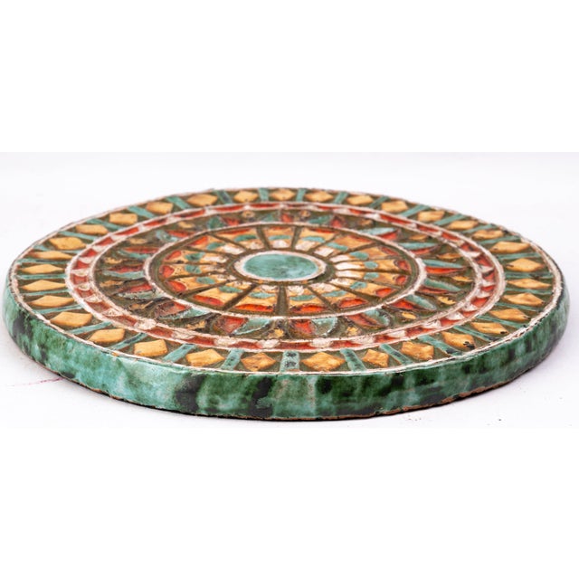 A glazed ceramic trivet made by Roland Zobel (1915–2006) for his workshop Les Cyclades in Anduze, The geometric and...
