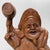 An expressive Japanese figure of Daikokuten, the god of good fortune, prosperity and abundance, carved from solid wood....