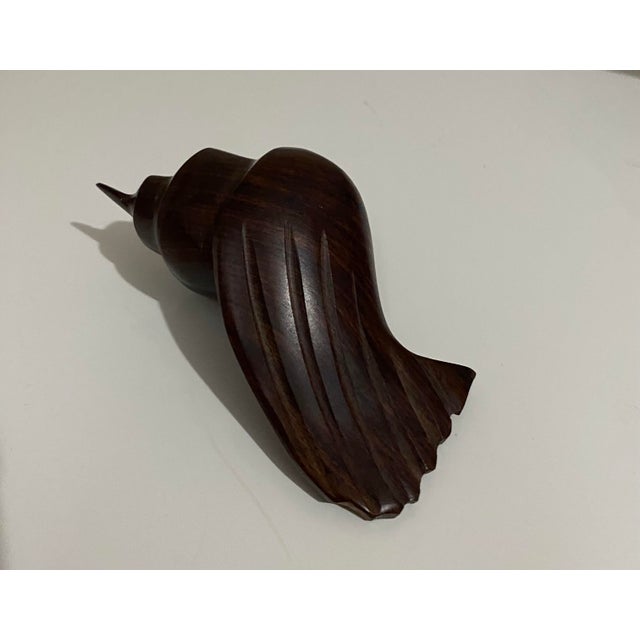 Conch shell 4”l x 2”w x 1-3/4”h Dolphin height - 12 dia- 4.5” Iron wood. Hard wood, but so smooth. I love the look and feel.