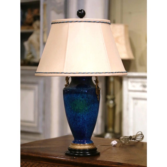 Rich color and elegant classical details give this vintage urn-form lamp a striking decorative presence. Crafted in France...