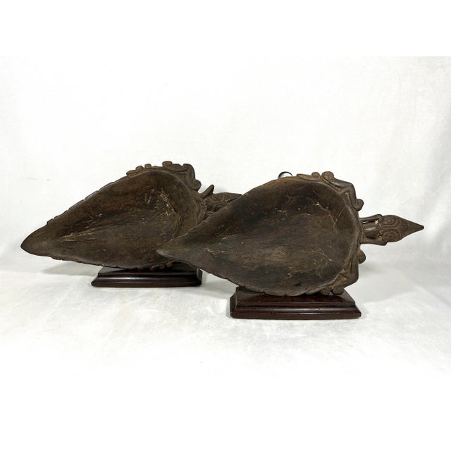 A pair of large, old primitive tribal ceremonial bowls, hand carved from tropical hard wood. Dark brown in colour,...