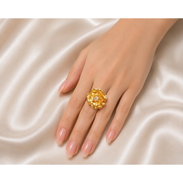 Elegant 14K yellow brushed gold cocktail ring featuring 7 brilliant round diamonds totaling 0.4 carats in a floral-...