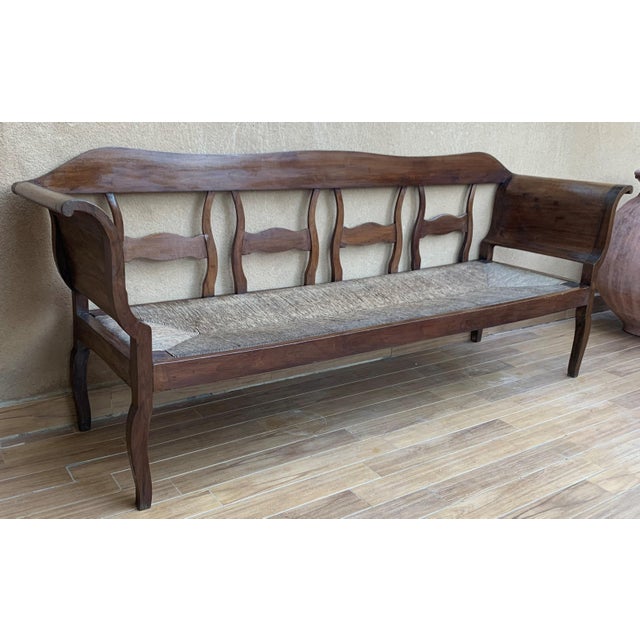 About Rare midcentury sofa, settee or bench in the Spanish style with cane back. Shown in original condition, please note...