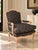 An elegant vintage Louis XV–style bergère armchair featuring a carved exposed wood frame and upholstered seat, back, and...