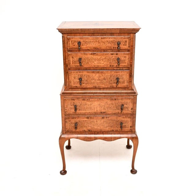 A charming and useful antique burr walnut chest on chest of drawers. This was made in England, it dates from around the...