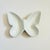 A vintage divided ceramic tray in the shape of a butterfly. Finished in a glossy white glaze. Perfect for using as a...