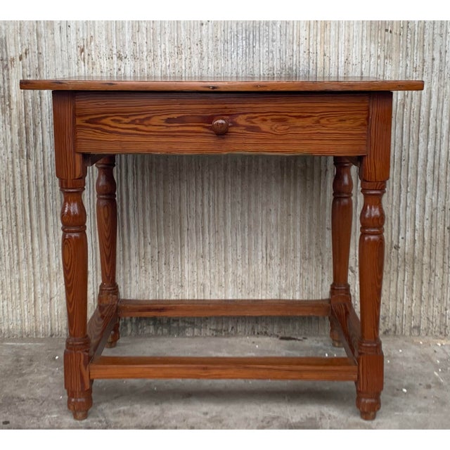 Vintage pine "mobila" farmhouse side table made in Spain. The table features a thick plank top supported by four tourned...