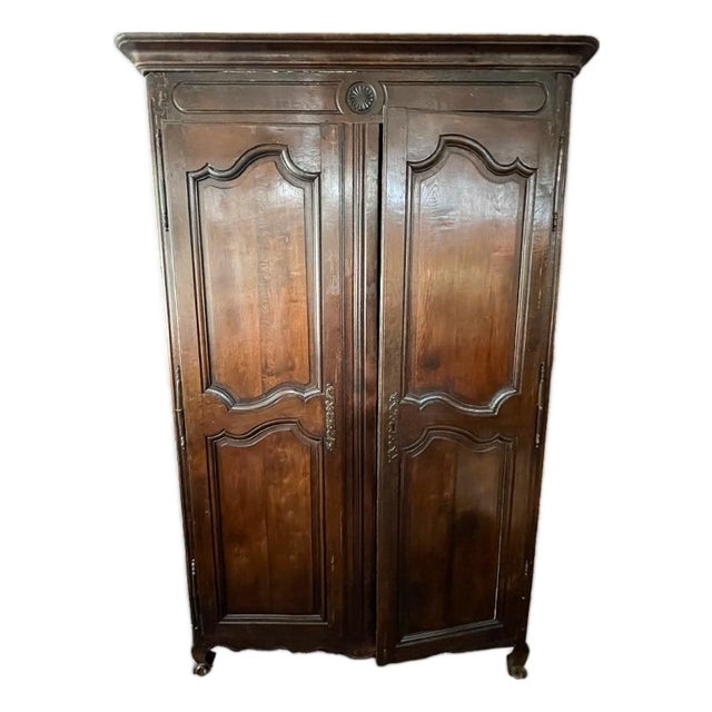 This piece has two shelves installed. It has been dated using the flower rosette medallion.