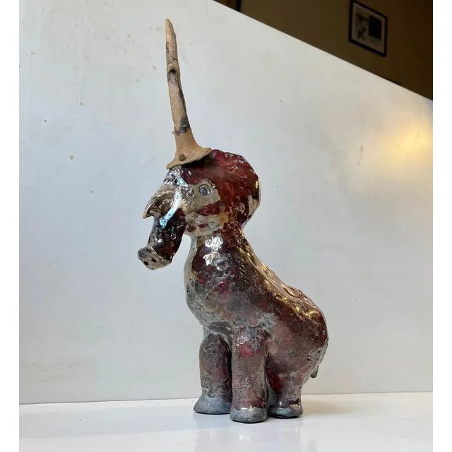 Unique artist/ceramist signed unicorn in raku burnt stoneware. A vase variety of different glaze colors and the 'horn'...