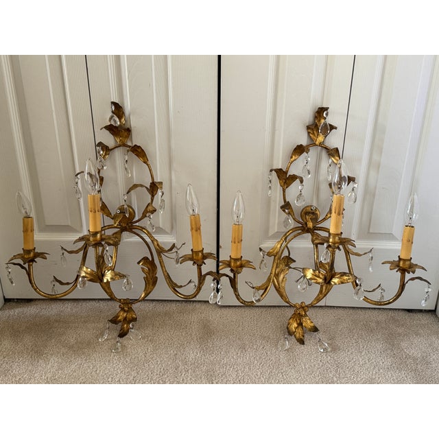 Offering for sale this stunning pair of Florentine-style, gilt tole, 3-arm wall sconces with the following fine features:...